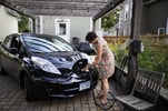 Jennifer Morrow Charging Electric Vehicle